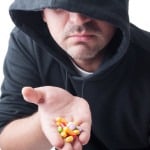 Stranger giving pills